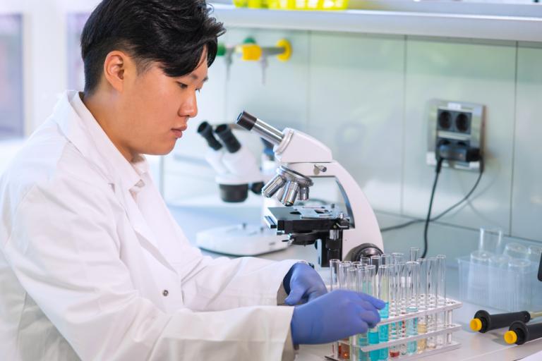 Asian scientist working in lab.