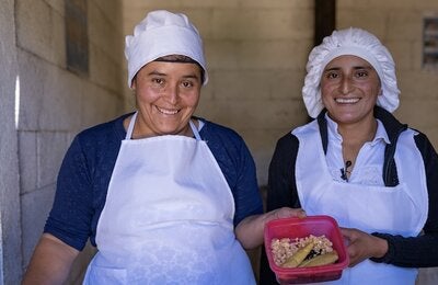 Two female workers with protection