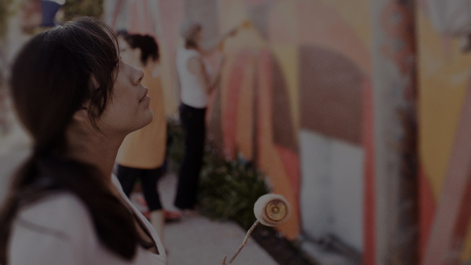 Young woman admiring artistic mural