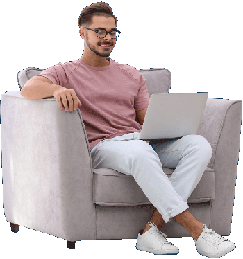 Male sitting on chair looking at laptop computer