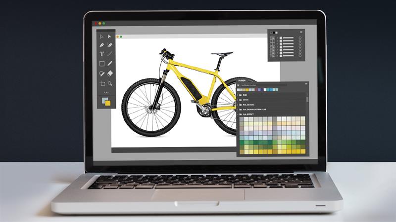 RAL digitale Farbbibliotheken | RAL FARBEN
Das Bild zeigt einen Laptop, auf dem eine Produktdesignsoftware geöffnet ist, in der ein Fahrrad mit gelben RAL Farben eingefärbt wird. Der Laptop steht auf einem hellen Untergrund vor einem dunkelgrauen Hintergrund.

RAL digital colour libraries | RAL COLOURS
The picture shows a laptop with product design software open in which a bicycle is being coloured with yellow RAL colours. The laptop is on a light surface against a dark grey background.