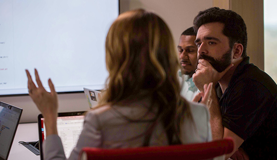 Technical Account Managers sitting around a table