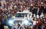 Pope Francis gestures to Catholic faithful after leading holy mass at the Esplanade of Tasitolu in Dili, East Timor