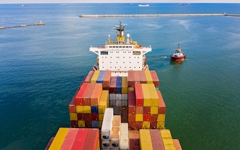 Aerial view of freight ship with cargo containers