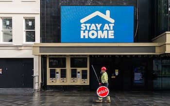 An empty Leicester Square with a 'Stay at Home' sign as England enters a four-week lockdown