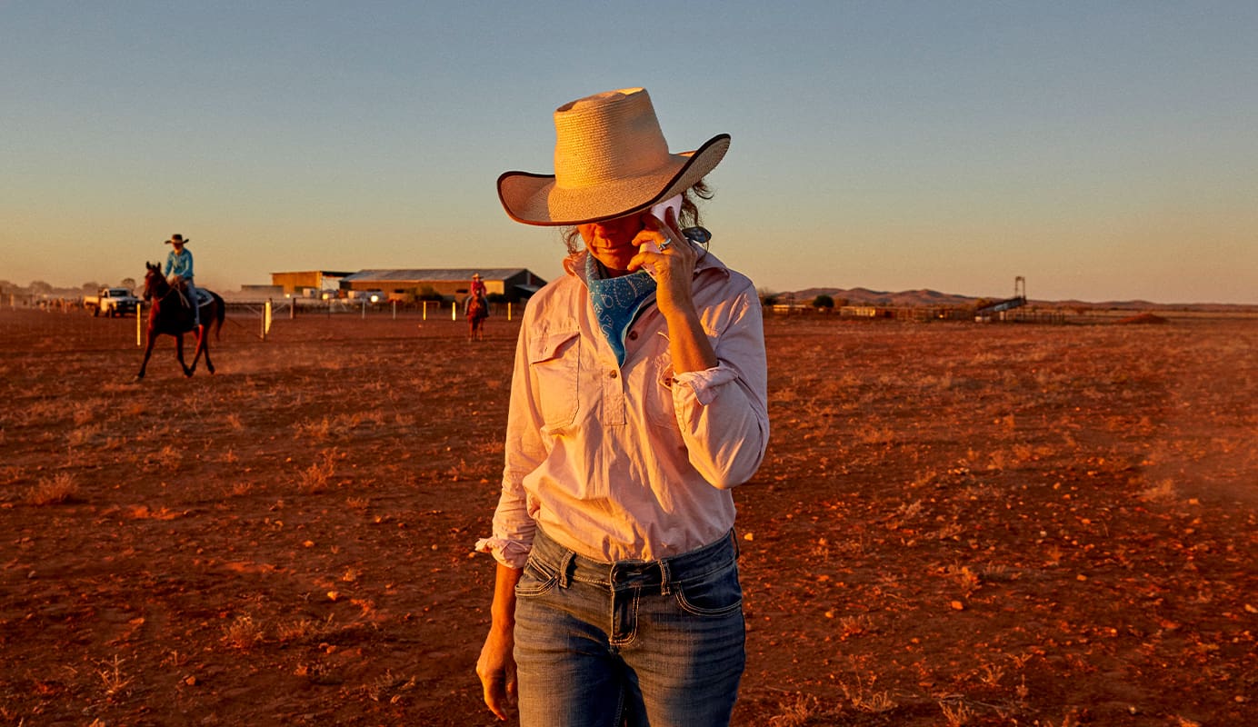 Lady taking a phone call on her mobile phone using Telstra's network