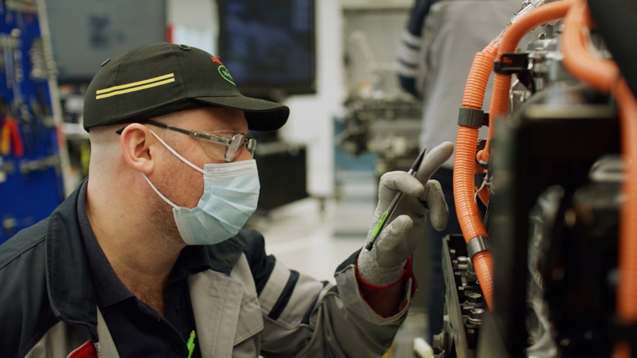 Toyota employee inspecting fuell cell