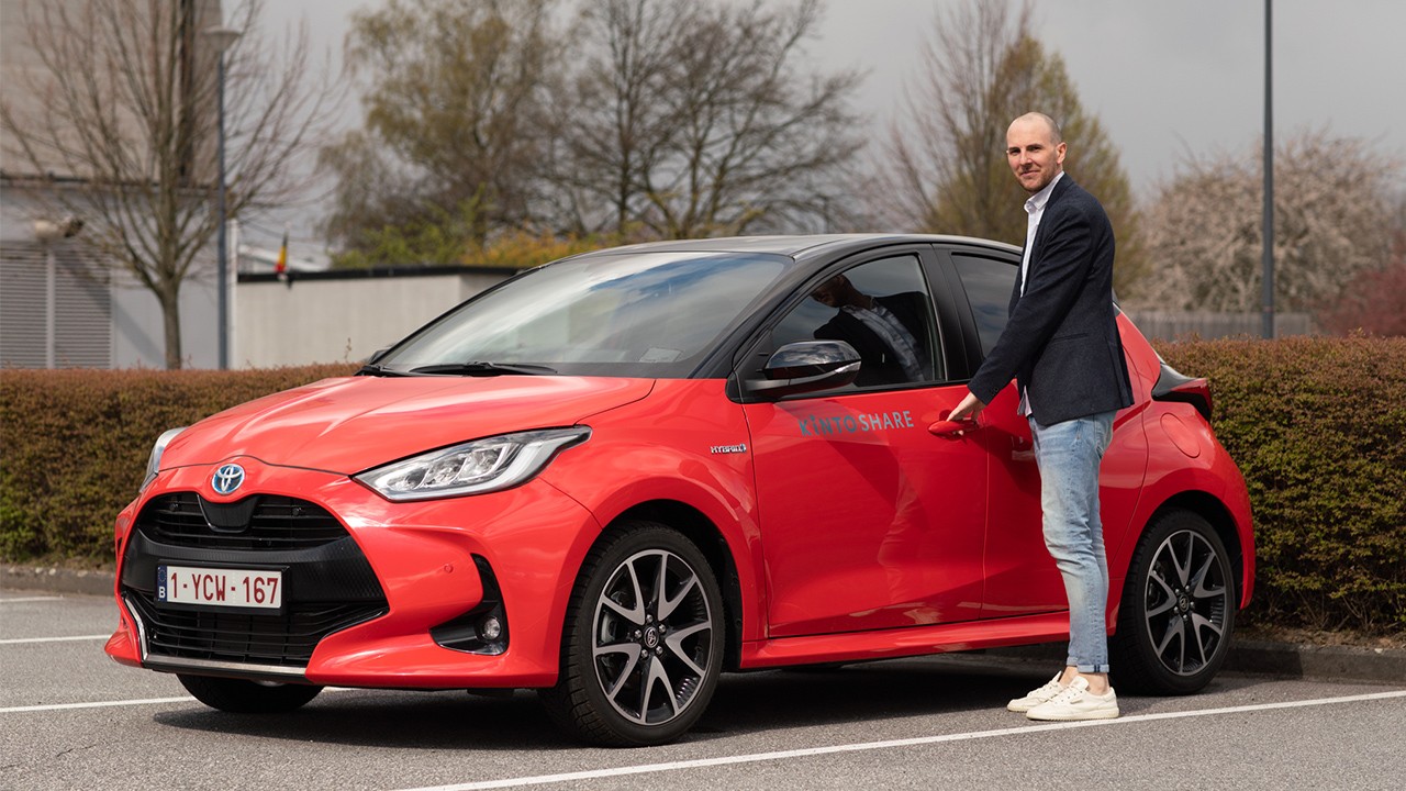 Man in front of his Toyota Car