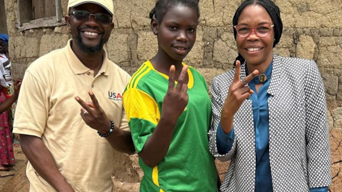 Watta Sagno, center, with USAID Guinea Democracy and Governance team.