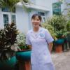 Dr. Thai Thi Hai Yen in the garden at Dĩ An City Hospital in Vietnam.