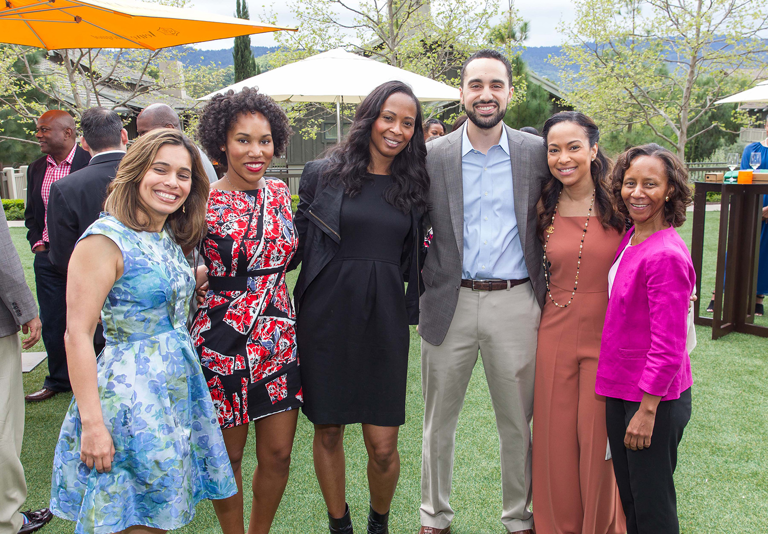 Marian Croak poses with four Google employees at an outdoor event