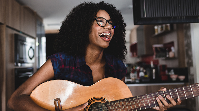 A person playing the guitar