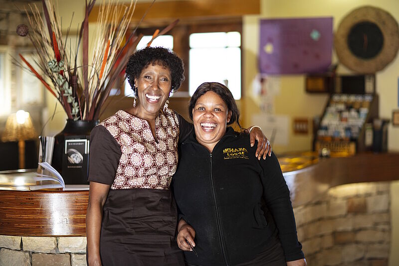 Two employees in tourism at a reception desk